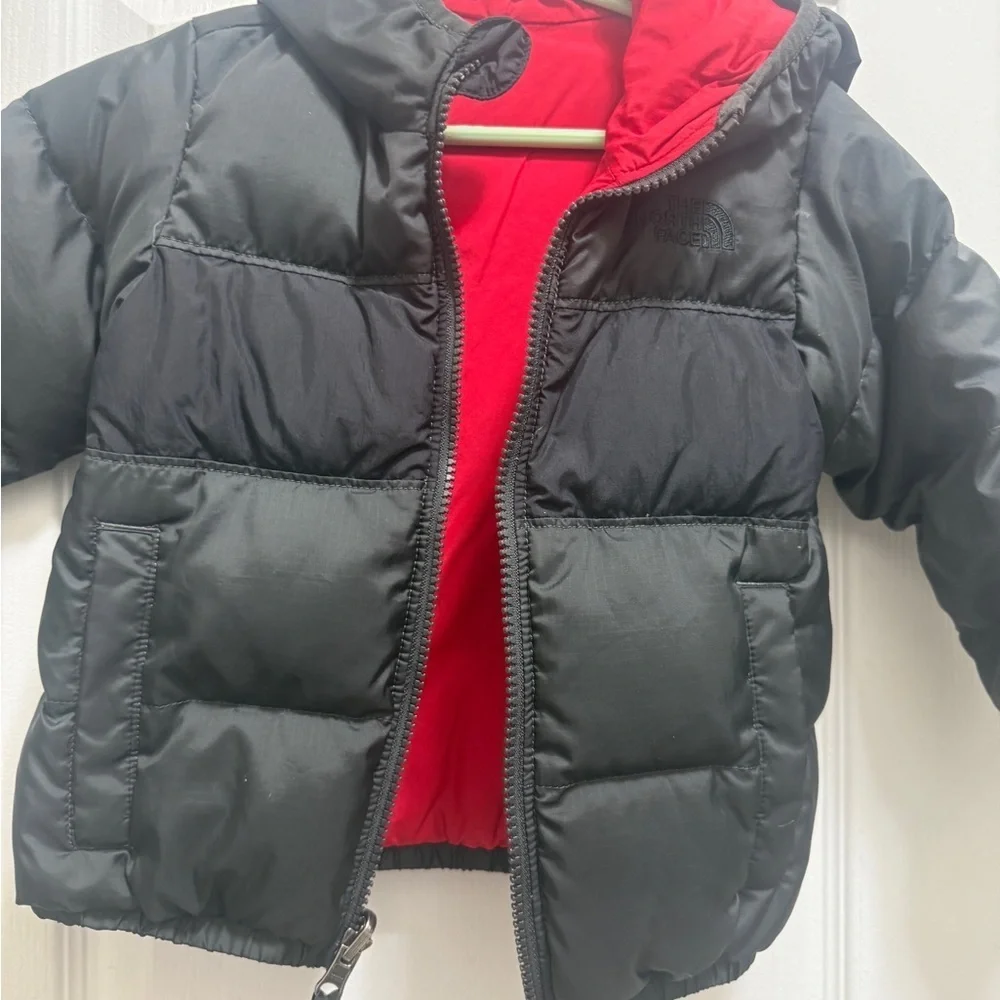 The North Face Kids Black and Red Puffer Jacket. Two-sided black and red